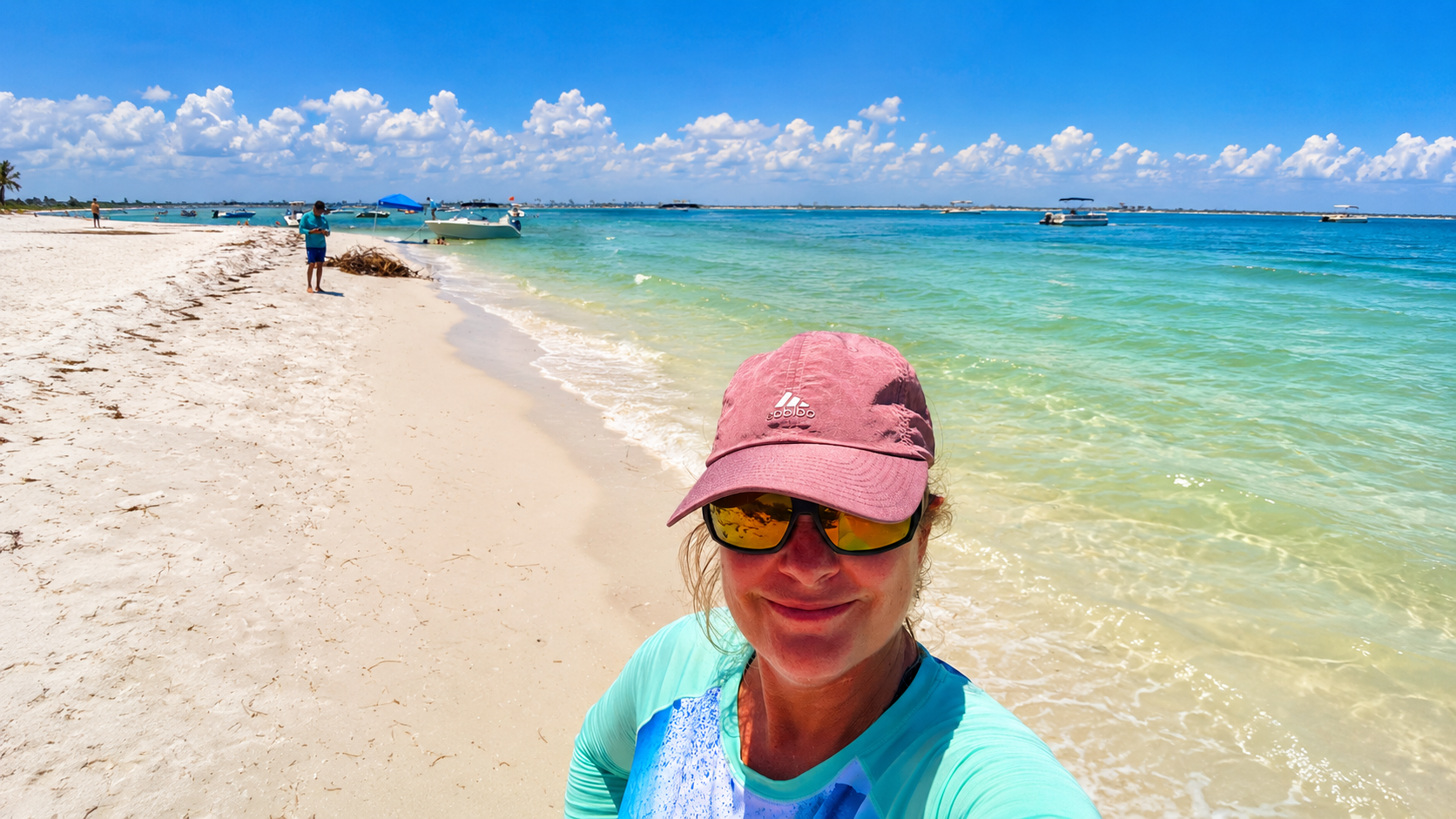 Private boat charter near Dunedin Florida with clear Gulf water and barrier islands