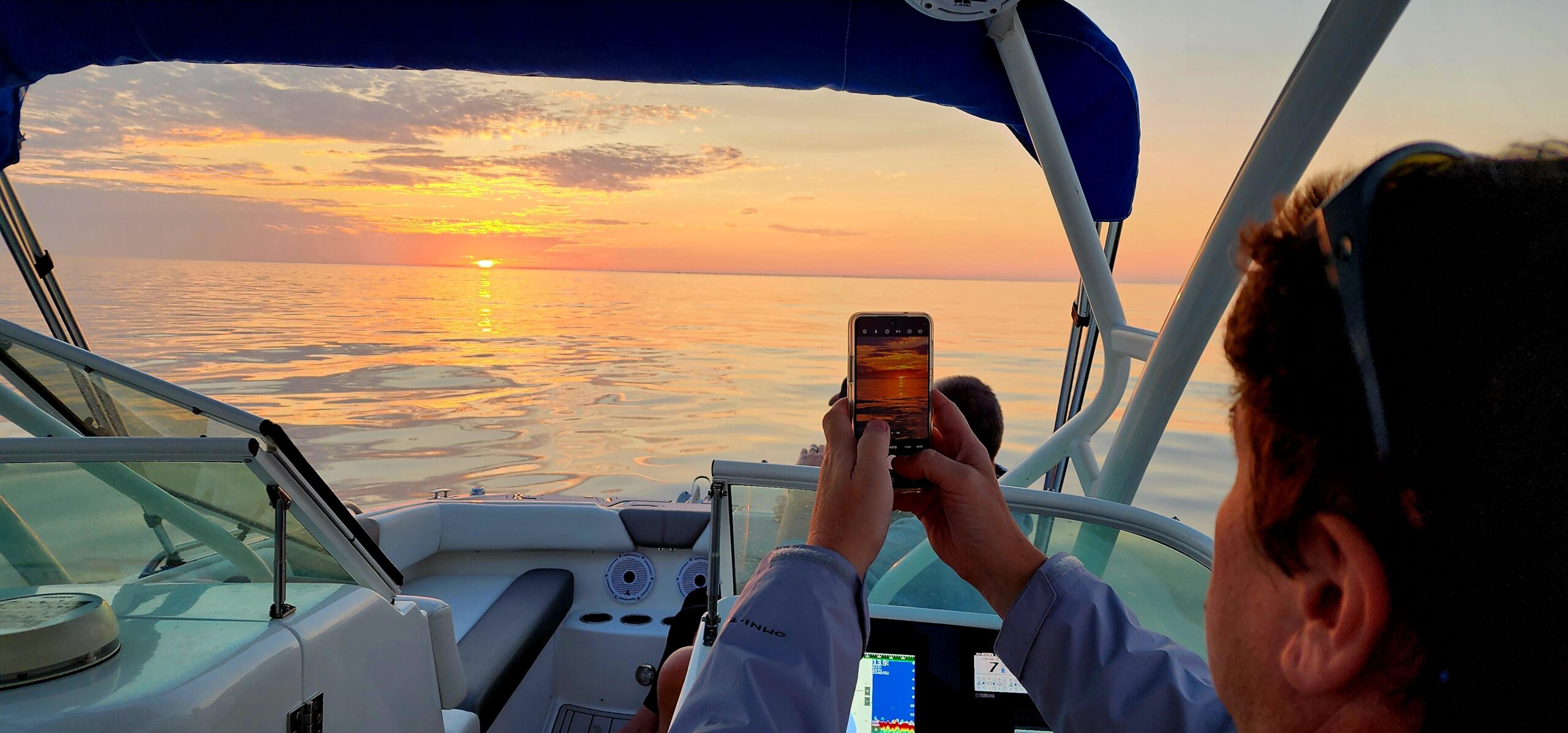 Beautiful Gulf Coast sunset viewed from a private charter boat near Clearwater Florida