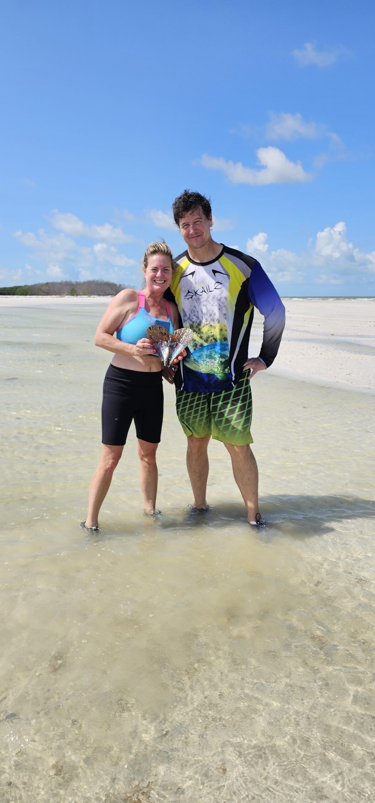 Guests looking for shells along a Gulf Coast sandbar