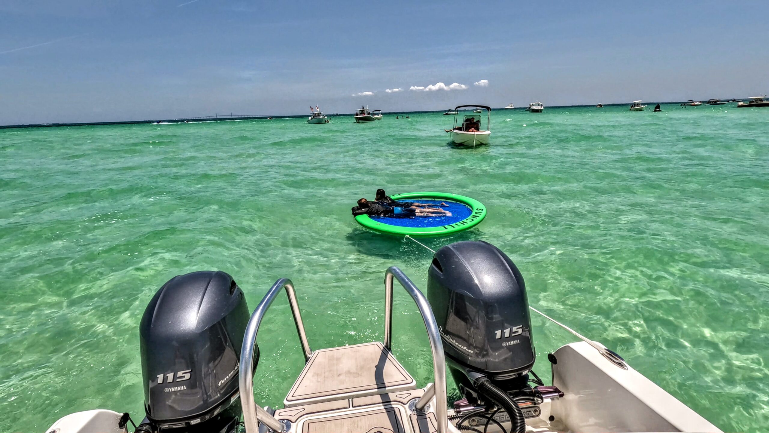 Guest relaxing on a Sunchill float in shallow water near Passage Key, Florida