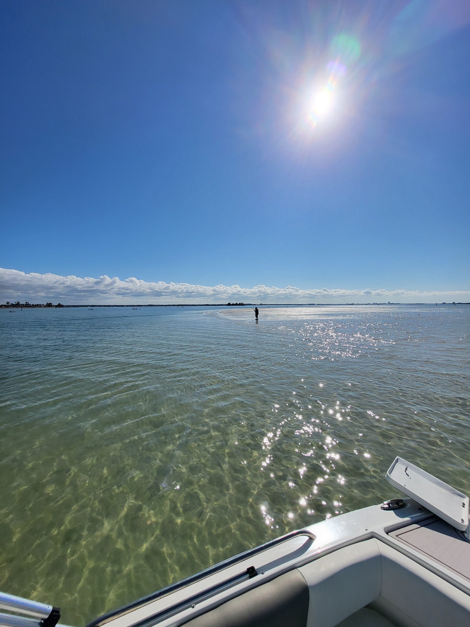 Gulf Coast sandbar visible in the distance from the water