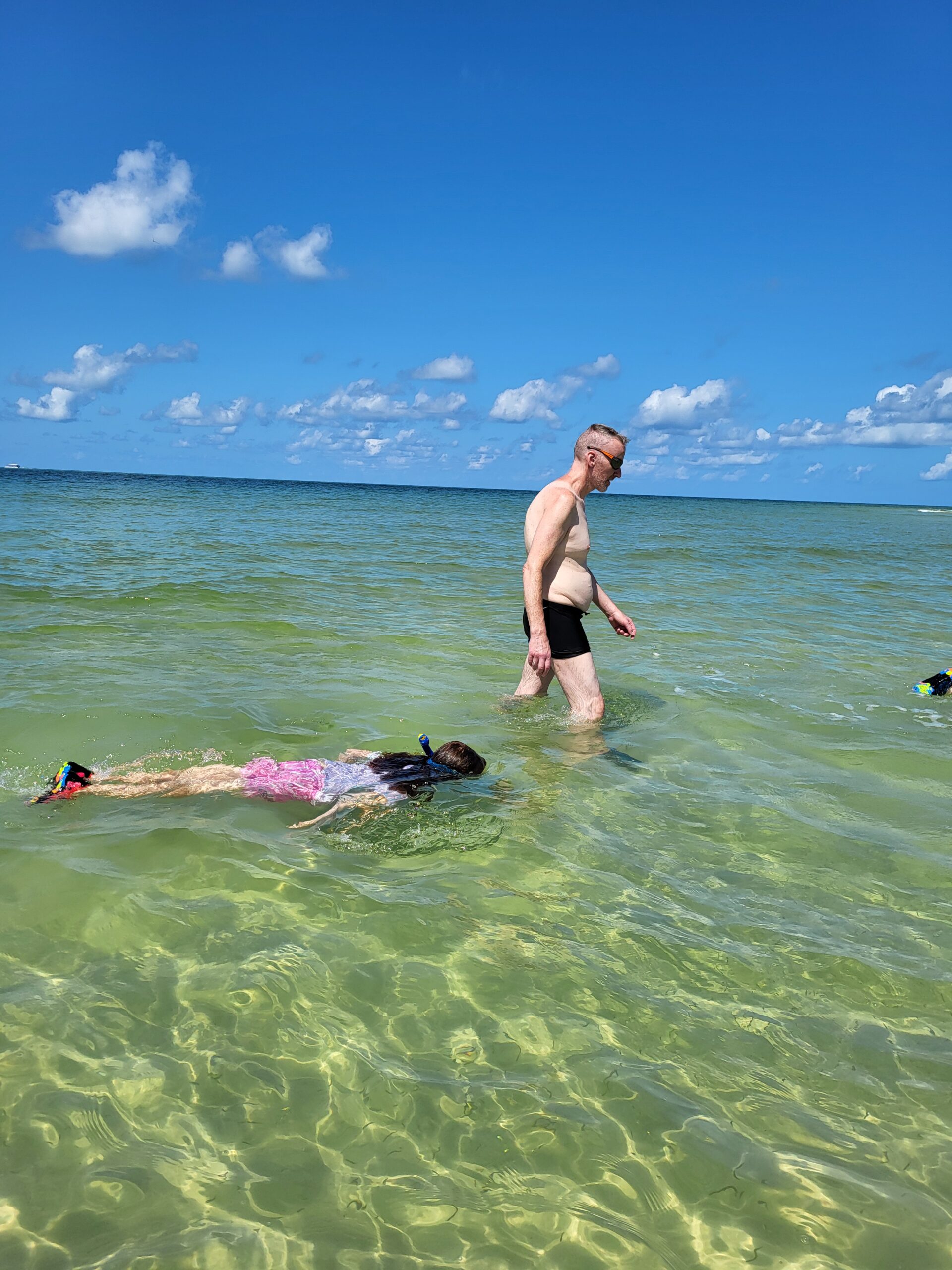 Guest snorkeling in shallow water at a Gulf Coast sandbar
